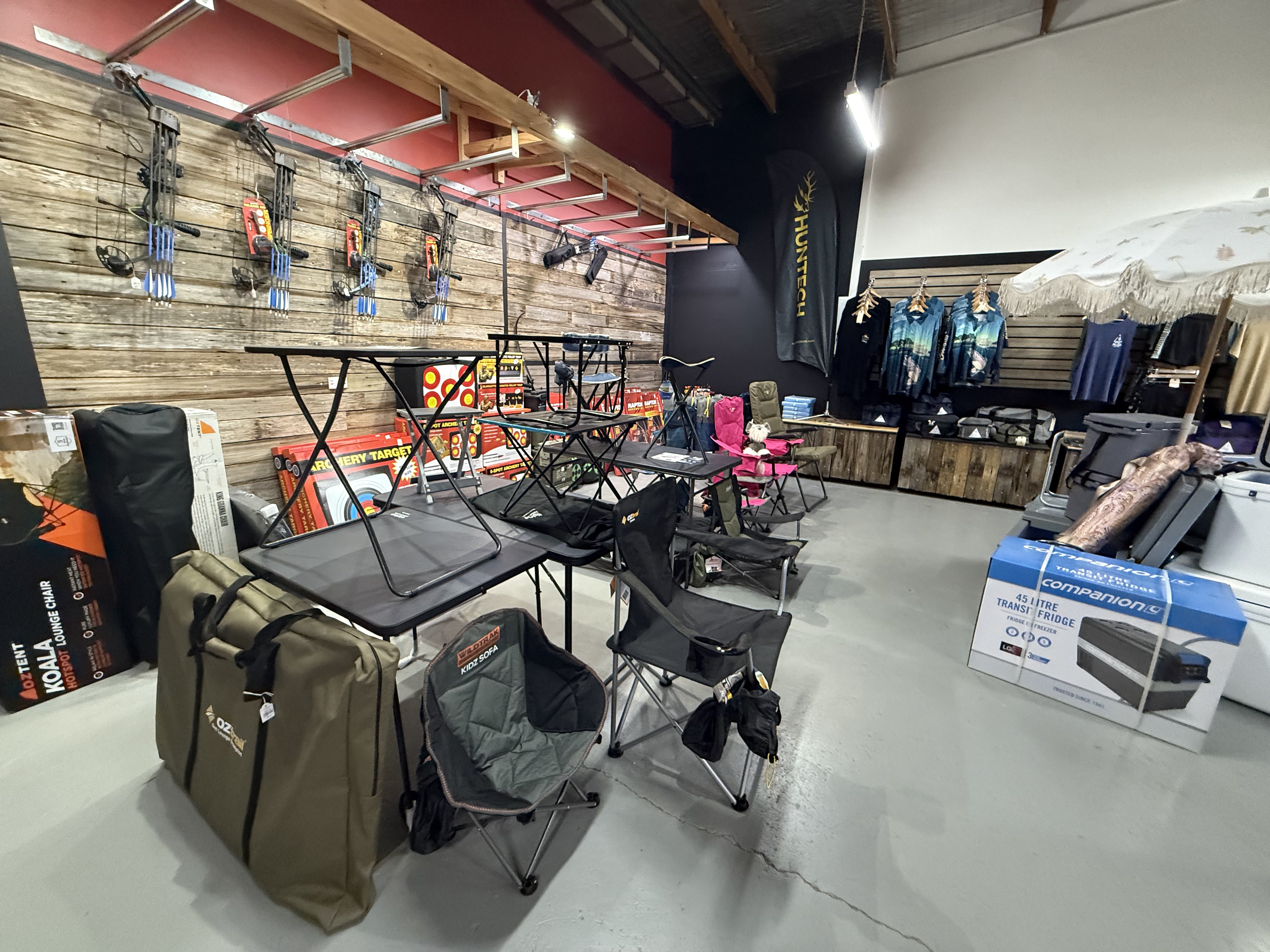 Summit Outfitters store display with Camp Tables & Chairs, Eskys and Coolers and Archery Products
