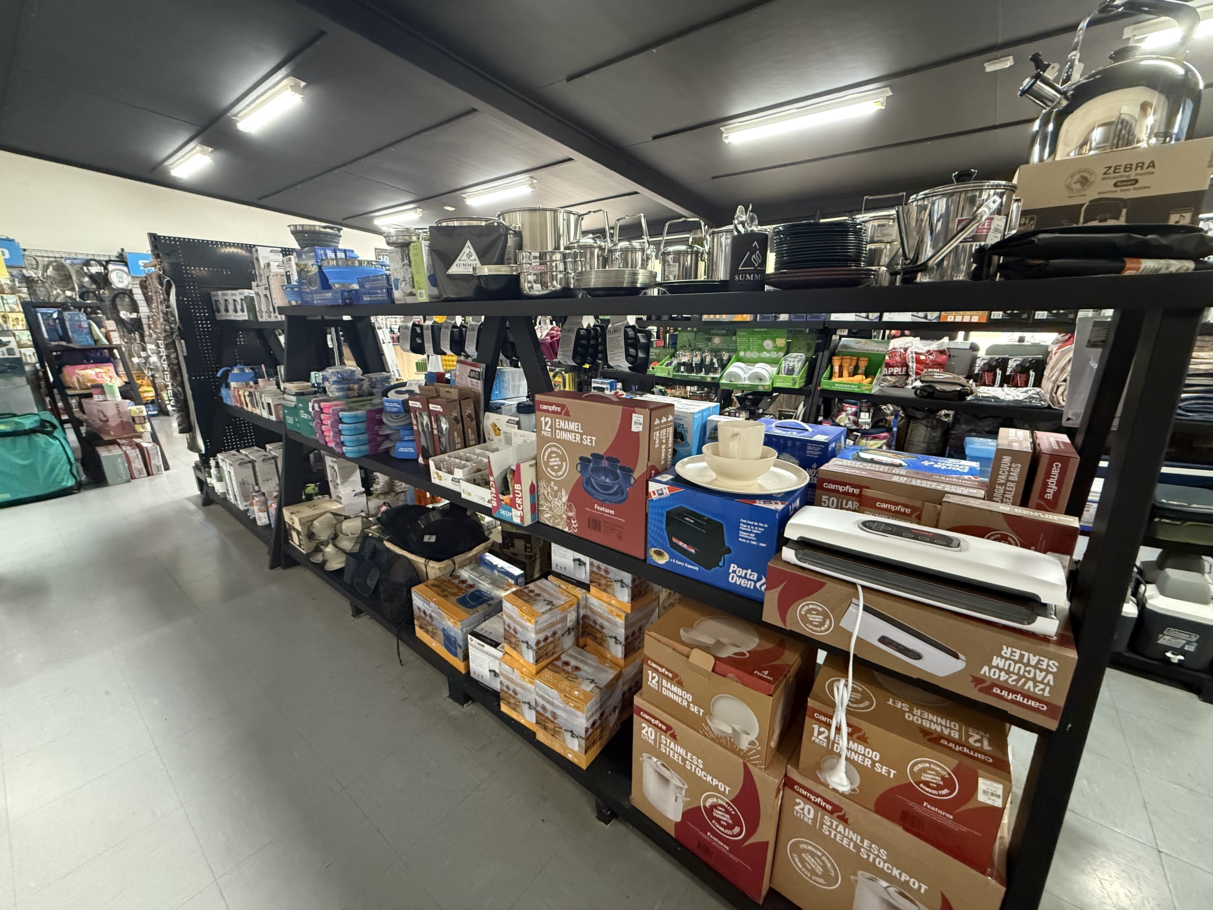 Summit Outfitters store aisle with Camping Pots, Billys, & Kettles. Cookware and Utensils