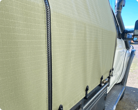 Close-up of Canvans truck side cover with zipper and fasteners