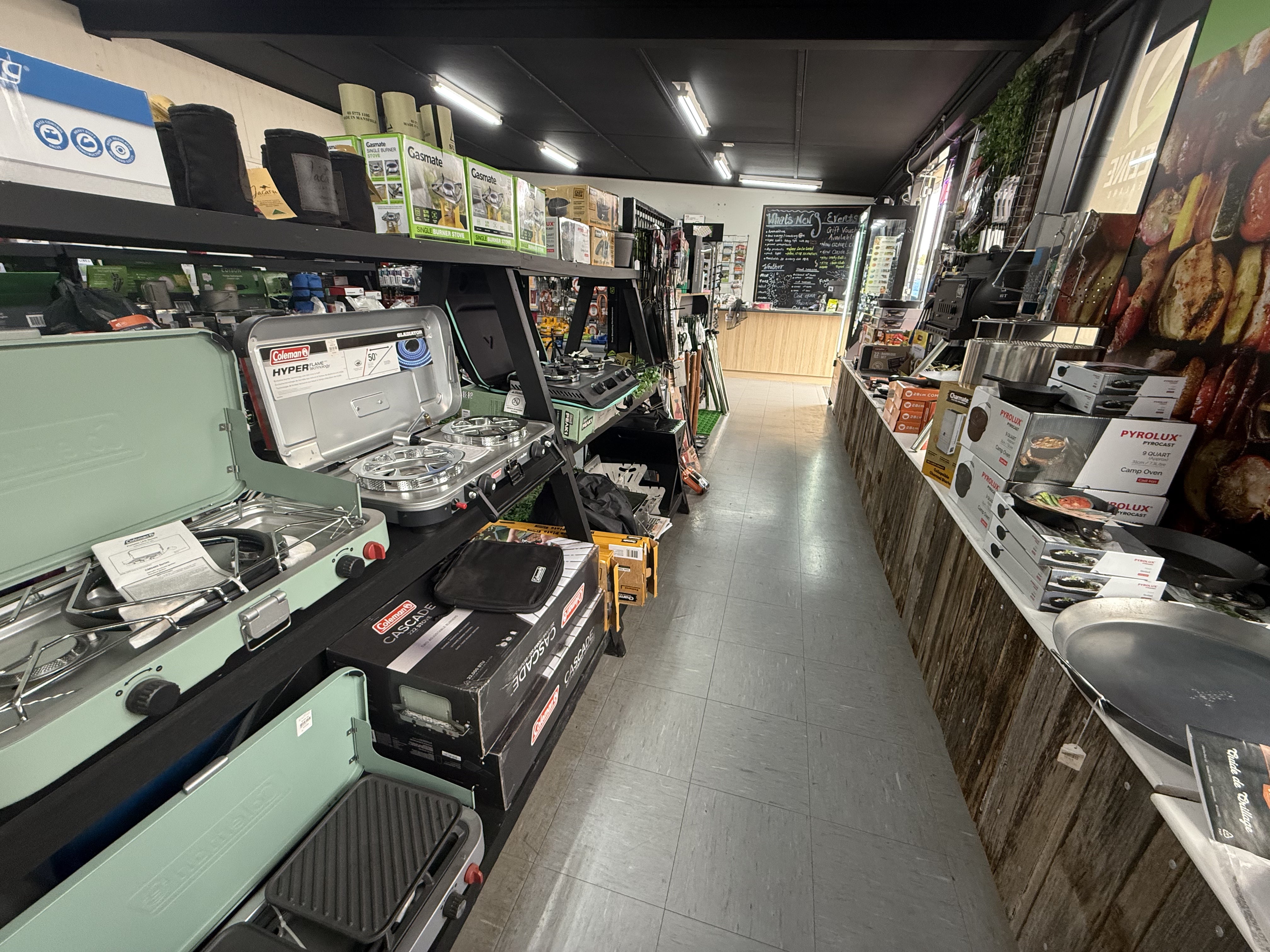 Summit Outfitters store shelves with Gas Stoves, Gas bottles & Campfire Cooking Tools