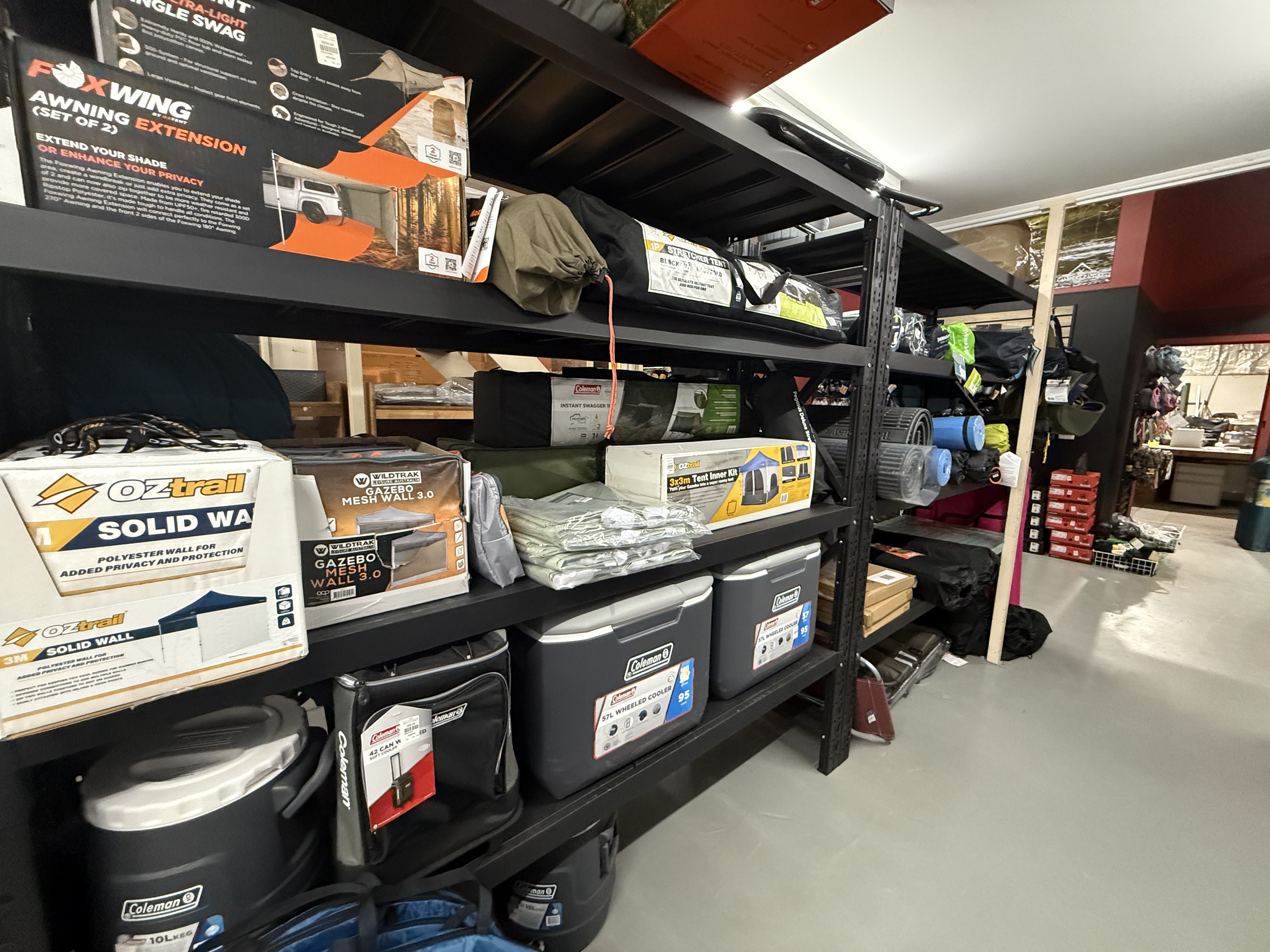 Summit Outfitters store shelves with Gazebos, Pop-up ensuites, Tents, Mattresses & Stretchers