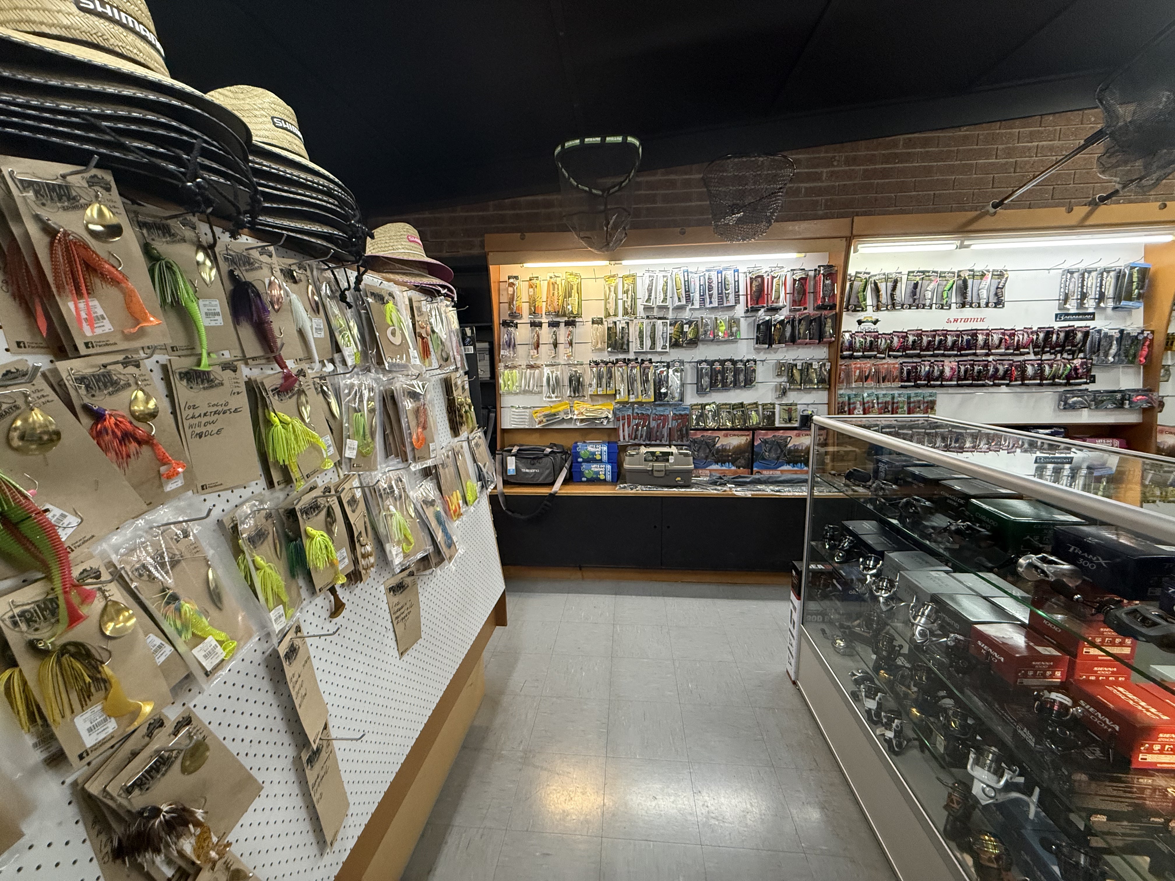 Summit Outfitters store interior with lures, hats, nets, reels & tackle gear