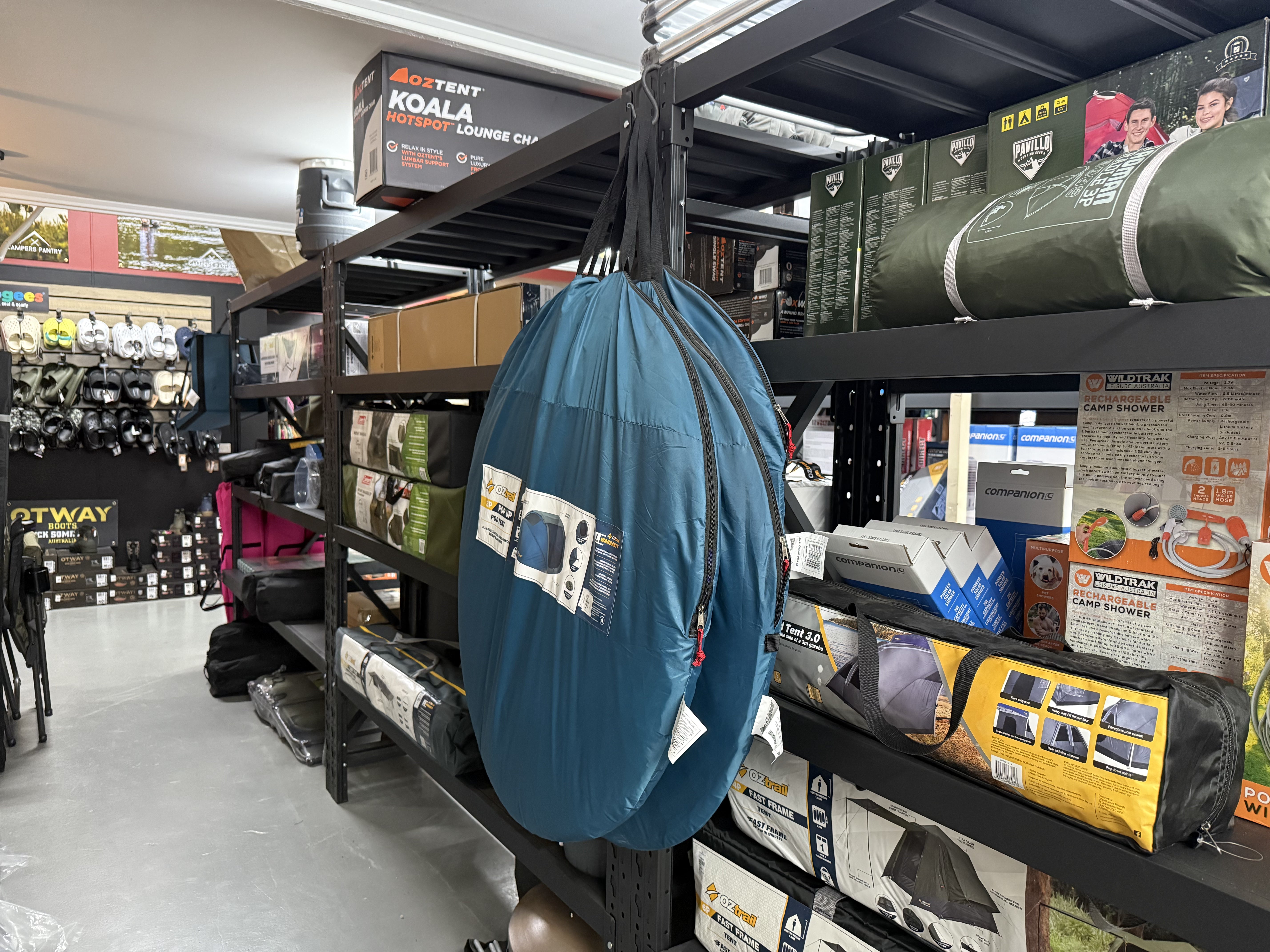Summit Outfitters store shelves with Oztent chairs, Pavillo tents & Vildtrak showers
