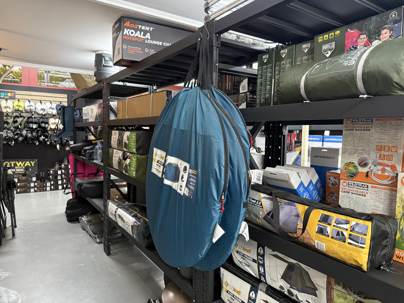 Summit Outfitters store shelves with Oztent chairs, Pavillo tents & Vildtrak showers