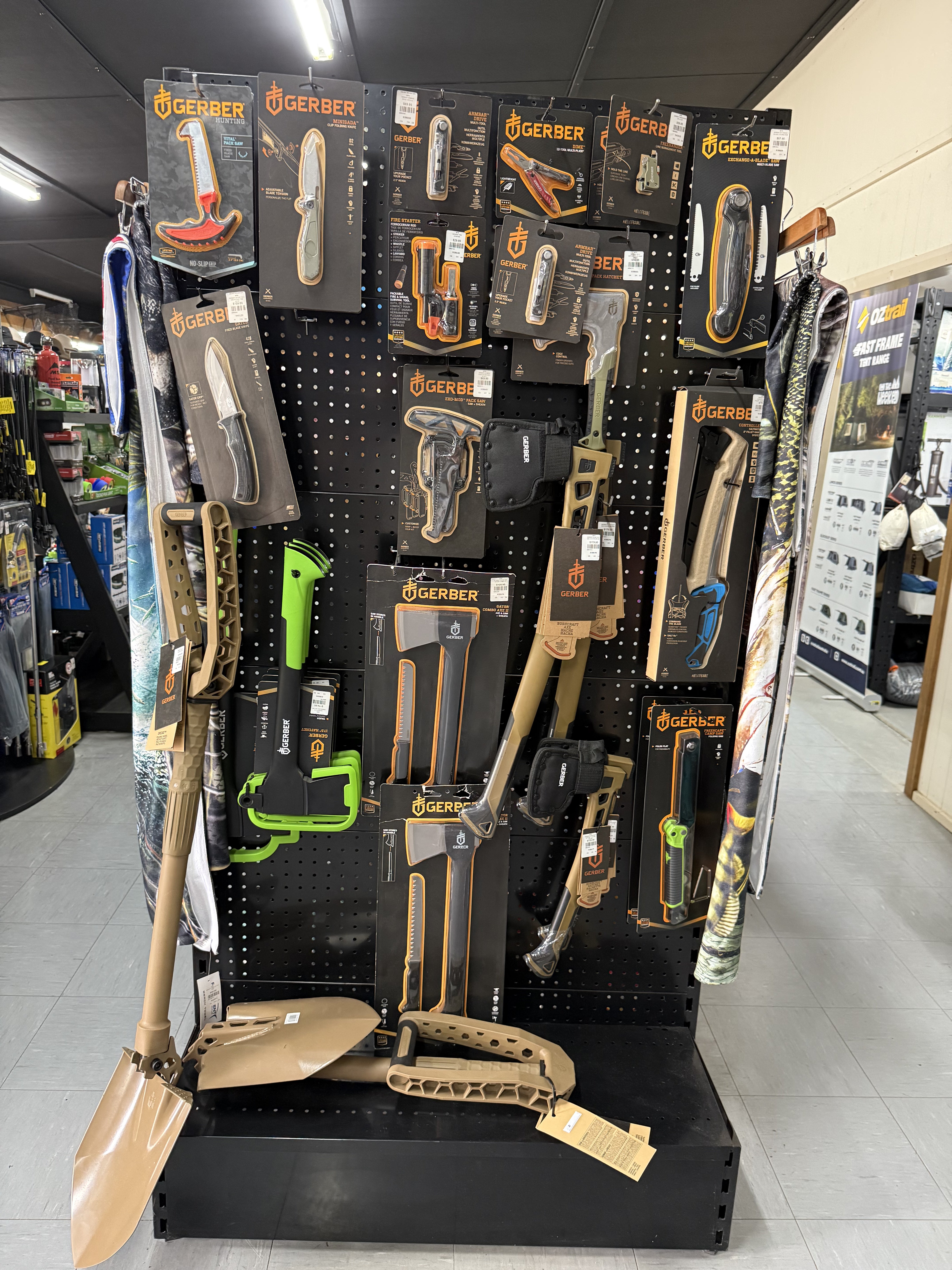 Summit Outfitters store display with Gerber knives, hatchets, shovels & outdoor tools