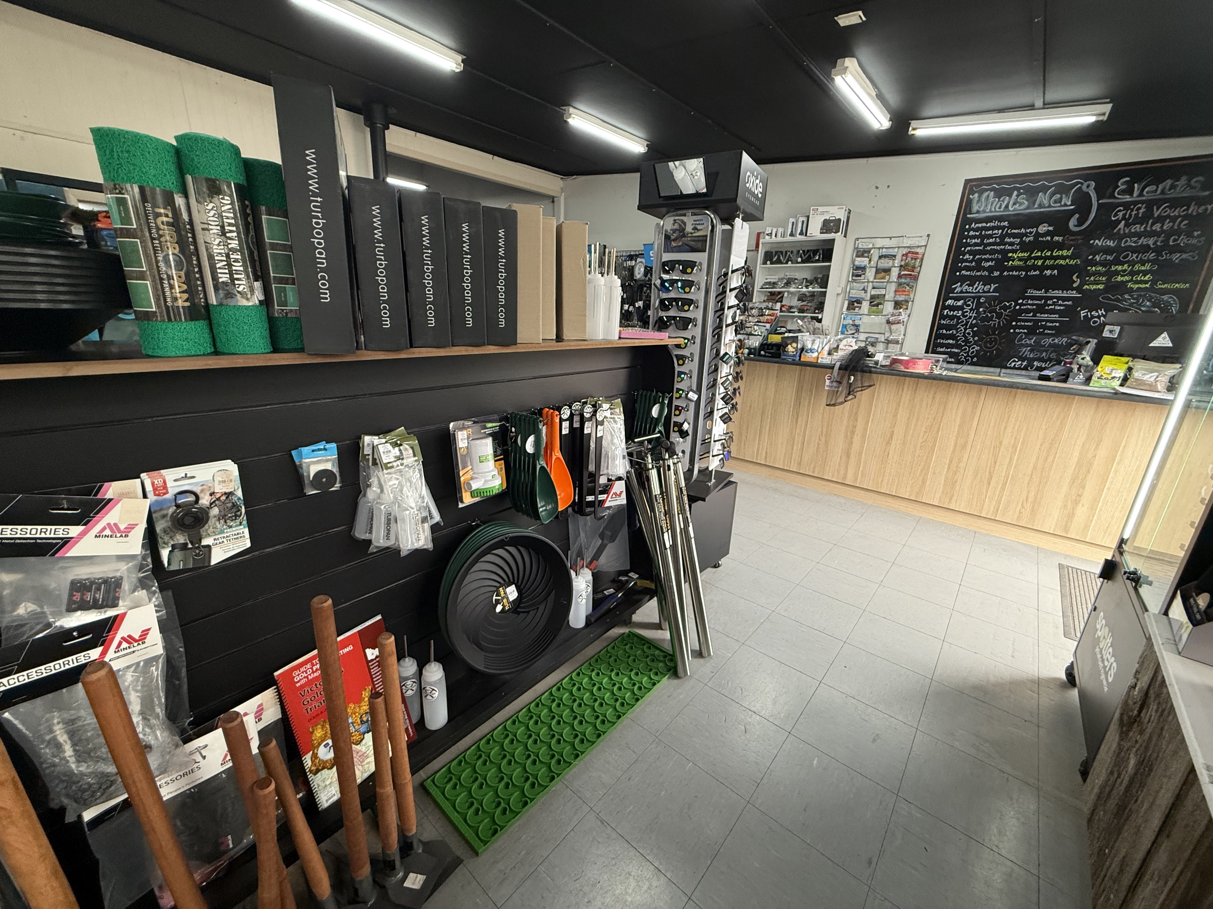 Summit Outfitters store interior with turbo pan gear, tools, mats & prospecting supplies