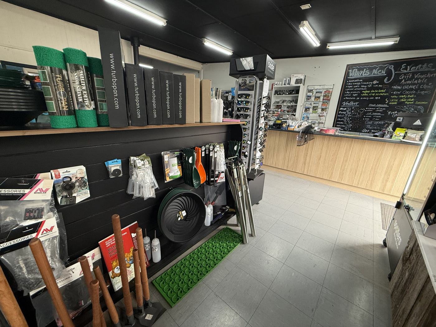 Summit Outfitters store interior with turbo pan gear, tools, mats & prospecting supplies